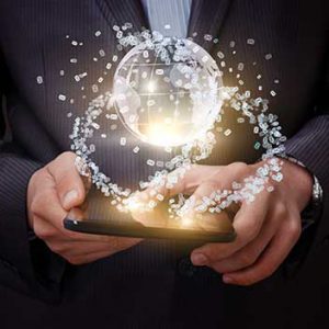 A man in a suit holding a tablet with a glowing planet Earth emerging from its screen.